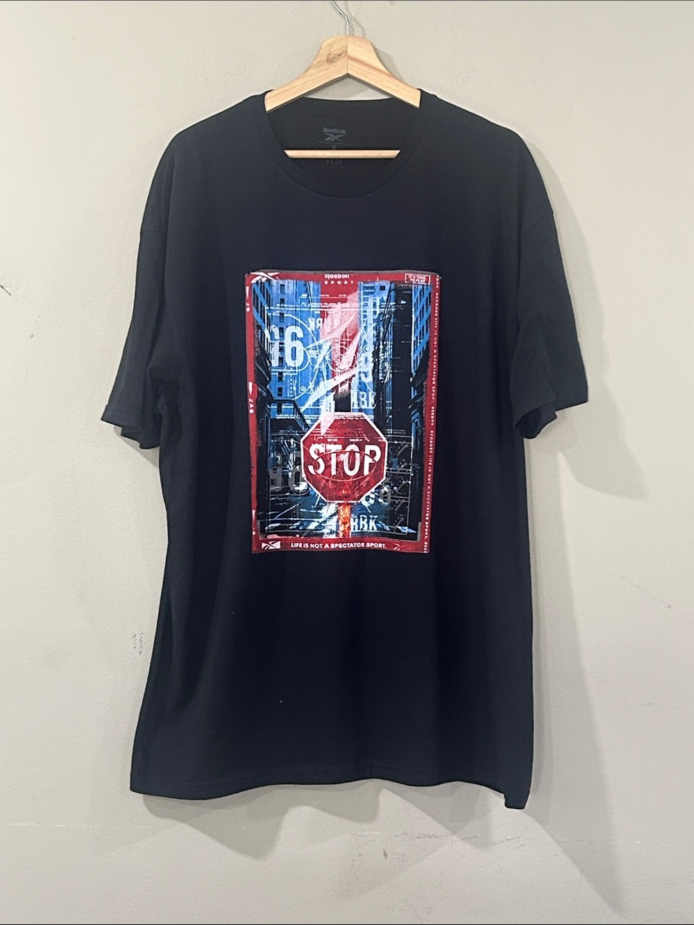 Reebok Black Short Sleeve Tee with Red and Blue Stop Sign Graphic